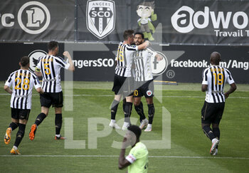 2021-05-09 - Angelo Fulgini of Angers celebrates his goal with teammates during the French championship Ligue 1 football match between Angers SCO and Dijon FCO (DFCO) on May 9, 2021 at Stade Raymond Kopa in Angers, France - Photo Jean Catuffe / DPPI - ANGERS SCO VS DIJON FCO (DFCO) - FRENCH LIGUE 1 - SOCCER
