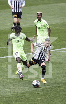 2021-05-09 - Farid El Melali of Angers, Mama Balde of Dijon, Didier Ndong of Dijon during the French championship Ligue 1 football match between Angers SCO and Dijon FCO (DFCO) on May 9, 2021 at Stade Raymond Kopa in Angers, France - Photo Jean Catuffe / DPPI - ANGERS SCO VS DIJON FCO (DFCO) - FRENCH LIGUE 1 - SOCCER