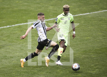 2021-05-09 - Farid El Melali of Angers, Didier Ndong of Dijon during the French championship Ligue 1 football match between Angers SCO and Dijon FCO (DFCO) on May 9, 2021 at Stade Raymond Kopa in Angers, France - Photo Jean Catuffe / DPPI - ANGERS SCO VS DIJON FCO (DFCO) - FRENCH LIGUE 1 - SOCCER