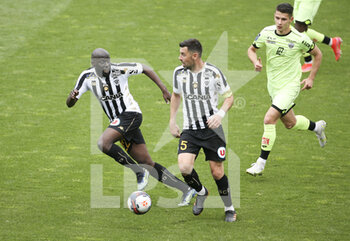 2021-05-09 - Sada Thioub, Thomas Mangani of Angers, Mihai-Alexandru Alex Dobre of Dijon during the French championship Ligue 1 football match between Angers SCO and Dijon FCO (DFCO) on May 9, 2021 at Stade Raymond Kopa in Angers, France - Photo Jean Catuffe / DPPI - ANGERS SCO VS DIJON FCO (DFCO) - FRENCH LIGUE 1 - SOCCER