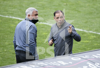 2021-05-09 - Coach of Angers SCO Stephane Moulin and assistant coach Patrice Sauvaget (left) during the French championship Ligue 1 football match between Angers SCO and Dijon FCO (DFCO) on May 9, 2021 at Stade Raymond Kopa in Angers, France - Photo Jean Catuffe / DPPI - ANGERS SCO VS DIJON FCO (DFCO) - FRENCH LIGUE 1 - SOCCER