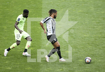 2021-05-09 - Lois Diony of Angers, Bruno Ecuele Manga of Dijon (left) during the French championship Ligue 1 football match between Angers SCO and Dijon FCO (DFCO) on May 9, 2021 at Stade Raymond Kopa in Angers, France - Photo Jean Catuffe / DPPI - ANGERS SCO VS DIJON FCO (DFCO) - FRENCH LIGUE 1 - SOCCER