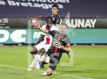 2021-05-09 - Damien Da Silva of Rennes, Moise Kean of PSG, Nayef Aguerd of Rennes during the French championship Ligue 1 football match between Stade Rennais and Paris Saint-Germain on May 9, 2021 at Roazhon Park in Rennes, France - Photo Jean Catuffe / DPPI - STADE RENNAIS VS PARIS SAINT-GERMAIN (PSG) - FRENCH LIGUE 1 - SOCCER