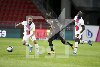 2021-05-09 - Serhou Guirassy of Rennes between Marquinhos and Danilo Pereira of PSG during the French championship Ligue 1 football match between Stade Rennais and Paris Saint-Germain on May 9, 2021 at Roazhon Park in Rennes, France - Photo Jean Catuffe / DPPI - STADE RENNAIS VS PARIS SAINT-GERMAIN (PSG) - FRENCH LIGUE 1 - SOCCER