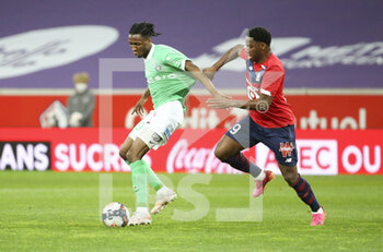 2021-05-16 - Yvan Neyou of Saint-Etienne, Jonathan David of Lille during the French championship Ligue 1 football match between Lille OSC (LOSC) and AS Saint-Etienne (ASSE) on May 16, 2021 at Stade Pierre Mauroy in Villeneuve-d'Ascq near Lille, France - Photo Jean Catuffe / DPPI - LILLE OSC (LOSC) VS AS SAINT-ETIENNE (ASSE) - FRENCH LIGUE 1 - SOCCER
