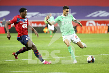 2021-05-16 - Timothee Kolodziejczak of Saint-Etienne, Jonathan David of Lille (left) during the French championship Ligue 1 football match between Lille OSC (LOSC) and AS Saint-Etienne (ASSE) on May 16, 2021 at Stade Pierre Mauroy in Villeneuve-d'Ascq near Lille, France - Photo Jean Catuffe / DPPI - LILLE OSC (LOSC) VS AS SAINT-ETIENNE (ASSE) - FRENCH LIGUE 1 - SOCCER