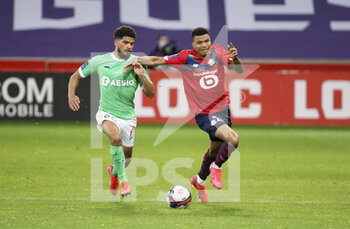 2021-05-16 - Reinildo Mandava of Lille, Mahdi Camara of Saint-Etienne (left) during the French championship Ligue 1 football match between Lille OSC (LOSC) and AS Saint-Etienne (ASSE) on May 16, 2021 at Stade Pierre Mauroy in Villeneuve-d'Ascq near Lille, France - Photo Jean Catuffe / DPPI - LILLE OSC (LOSC) VS AS SAINT-ETIENNE (ASSE) - FRENCH LIGUE 1 - SOCCER