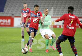 2021-05-16 - Reinildo Mandava of Lille, Wahbi Khazri of Saint-Etienne during the French championship Ligue 1 football match between Lille OSC (LOSC) and AS Saint-Etienne (ASSE) on May 16, 2021 at Stade Pierre Mauroy in Villeneuve-d'Ascq near Lille, France - Photo Jean Catuffe / DPPI - LILLE OSC (LOSC) VS AS SAINT-ETIENNE (ASSE) - FRENCH LIGUE 1 - SOCCER