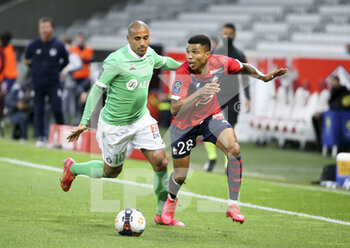 2021-05-16 - Reinildo Mandava of Lille, Wahbi Khazri of Saint-Etienne (left) during the French championship Ligue 1 football match between Lille OSC (LOSC) and AS Saint-Etienne (ASSE) on May 16, 2021 at Stade Pierre Mauroy in Villeneuve-d'Ascq near Lille, France - Photo Jean Catuffe / DPPI - LILLE OSC (LOSC) VS AS SAINT-ETIENNE (ASSE) - FRENCH LIGUE 1 - SOCCER