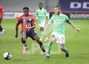 2021-05-16 - Mathieu Debuchy of Saint-Etienne, Jonathan David of Lille during the French championship Ligue 1 football match between Lille OSC (LOSC) and AS Saint-Etienne (ASSE) on May 16, 2021 at Stade Pierre Mauroy in Villeneuve-d'Ascq near Lille, France - Photo Jean Catuffe / DPPI - LILLE OSC (LOSC) VS AS SAINT-ETIENNE (ASSE) - FRENCH LIGUE 1 - SOCCER