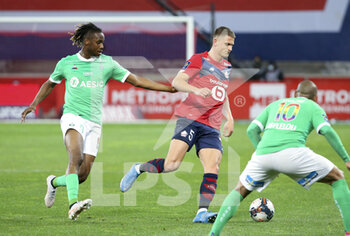 2021-05-16 - Sven Botman of Lille, Charles Abi of Saint-Etienne (left) during the French championship Ligue 1 football match between Lille OSC (LOSC) and AS Saint-Etienne (ASSE) on May 16, 2021 at Stade Pierre Mauroy in Villeneuve-d'Ascq near Lille, France - Photo Jean Catuffe / DPPI - LILLE OSC (LOSC) VS AS SAINT-ETIENNE (ASSE) - FRENCH LIGUE 1 - SOCCER