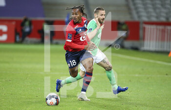 2021-05-16 - Renato Sanches of Lille, Mathieu Debuchy of Saint-Etienne during the French championship Ligue 1 football match between Lille OSC (LOSC) and AS Saint-Etienne (ASSE) on May 16, 2021 at Stade Pierre Mauroy in Villeneuve-d'Ascq near Lille, France - Photo Jean Catuffe / DPPI - LILLE OSC (LOSC) VS AS SAINT-ETIENNE (ASSE) - FRENCH LIGUE 1 - SOCCER