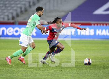 2021-05-16 - Renato Sanches of Lille, Denis Bouanga of Saint-Etienne (left) during the French championship Ligue 1 football match between Lille OSC (LOSC) and AS Saint-Etienne (ASSE) on May 16, 2021 at Stade Pierre Mauroy in Villeneuve-d'Ascq near Lille, France - Photo Jean Catuffe / DPPI - LILLE OSC (LOSC) VS AS SAINT-ETIENNE (ASSE) - FRENCH LIGUE 1 - SOCCER