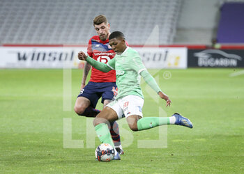 2021-05-16 - Zaydou Youssouf of Saint-Etienne, Xeka of Lille (left) during the French championship Ligue 1 football match between Lille OSC (LOSC) and AS Saint-Etienne (ASSE) on May 16, 2021 at Stade Pierre Mauroy in Villeneuve-d'Ascq near Lille, France - Photo Jean Catuffe / DPPI - LILLE OSC (LOSC) VS AS SAINT-ETIENNE (ASSE) - FRENCH LIGUE 1 - SOCCER