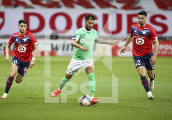 2021-05-16 - Denis Bouanga of Saint-Etienne between Luiz Araujo, Mehmet Zeki Celik of Lille during the French championship Ligue 1 football match between Lille OSC (LOSC) and AS Saint-Etienne (ASSE) on May 16, 2021 at Stade Pierre Mauroy in Villeneuve-d'Ascq near Lille, France - Photo Jean Catuffe / DPPI - LOSC LILLE VS AS SAINT-ETIENNE - FRENCH LIGUE 1 - SOCCER