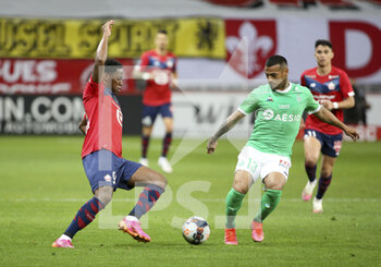 2021-05-16 - Jonathan David of Lille, Miguel Trauco of Saint-Etienne during the French championship Ligue 1 football match between Lille OSC (LOSC) and AS Saint-Etienne (ASSE) on May 16, 2021 at Stade Pierre Mauroy in Villeneuve-d'Ascq near Lille, France - Photo Jean Catuffe / DPPI - LOSC LILLE VS AS SAINT-ETIENNE - FRENCH LIGUE 1 - SOCCER