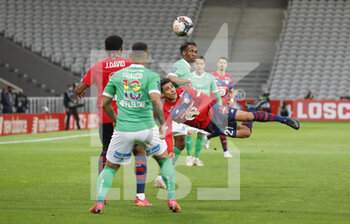 2021-05-16 - Benjamin Andre of LOSC and Yvan Neyou of Saint-Etienne during the French championship Ligue 1 football match between LOSC Lille and AS Saint-Etienne on May 16, 2021 at Pierre Mauroy stadium in Villeneuve-d'Ascq near Lille, France - Photo Loic Baratoux / DPPI - LOSC LILLE VS AS SAINT-ETIENNE - FRENCH LIGUE 1 - SOCCER