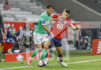 2021-05-16 - Denis Bouanga of Saint-Etienne and Zeki Celik of LOSC during the French championship Ligue 1 football match between LOSC Lille and AS Saint-Etienne on May 16, 2021 at Pierre Mauroy stadium in Villeneuve-d'Ascq near Lille, France - Photo Loic Baratoux / DPPI - LOSC LILLE VS AS SAINT-ETIENNE - FRENCH LIGUE 1 - SOCCER