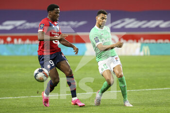 2021-05-16 - Timothee Kolodziejczak of Saint-Etienne, Jonathan David of Lille (left) during the French championship Ligue 1 football match between Lille OSC (LOSC) and AS Saint-Etienne (ASSE) on May 16, 2021 at Stade Pierre Mauroy in Villeneuve-d'Ascq near Lille, France - Photo Jean Catuffe / DPPI - LOSC LILLE VS AS SAINT-ETIENNE - FRENCH LIGUE 1 - SOCCER
