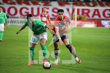 2021-05-16 - Duel ARAUJO 11 LOSC and TRAUCO 13 ASSE during the French championship Ligue 1 football match between LOSC Lille and AS Saint-Etienne on May 16, 2021 at Pierre Mauroy stadium in Villeneuve-d'Ascq near Lille, France - Photo Laurent Sanson / LS Medianord / DPPI - LOSC LILLE VS AS SAINT-ETIENNE - FRENCH LIGUE 1 - SOCCER