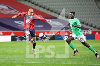 2021-05-16 - Burak YILMAZ 17 LOSC and SOW 35 ASSE during the French championship Ligue 1 football match between LOSC Lille and AS Saint-Etienne on May 16, 2021 at Pierre Mauroy stadium in Villeneuve-d'Ascq near Lille, France - Photo Laurent Sanson / LS Medianord / DPPI - LOSC LILLE VS AS SAINT-ETIENNE - FRENCH LIGUE 1 - SOCCER