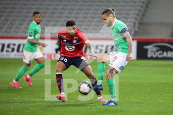 2021-05-16 - Captain Mathieu DEBUCHY 26 ASSE and REINILDO 28 LOSC during the French championship Ligue 1 football match between LOSC Lille and AS Saint-Etienne on May 16, 2021 at Pierre Mauroy stadium in Villeneuve-d'Ascq near Lille, France - Photo Laurent Sanson / LS Medianord / DPPI - LOSC LILLE VS AS SAINT-ETIENNE - FRENCH LIGUE 1 - SOCCER