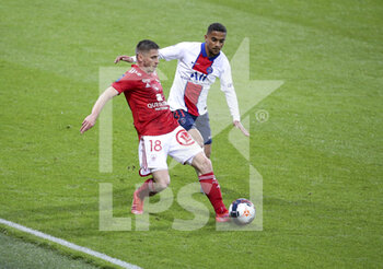 2021-05-23 - Romain Perraud of Brest, Colin Dagba of PSG during the French championship Ligue 1 football match between Stade Brestois 29 and Paris Saint-Germain (PSG) on May 23, 2021 at Stade Francis Le Ble in Brest, France - Photo Jean Catuffe / DPPI - STADE BRESTOIS 29 VS PARIS SAINT-GERMAIN (PSG) - FRENCH LIGUE 1 - SOCCER