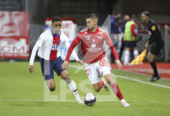 2021-05-23 - Romain Faivre of Brest, Abdou Diallo of PSG (left) during the French championship Ligue 1 football match between Stade Brestois 29 and Paris Saint-Germain (PSG) on May 23, 2021 at Stade Francis Le Ble in Brest, France - Photo Jean Catuffe / DPPI - STADE BRESTOIS 29 VS PARIS SAINT-GERMAIN (PSG) - FRENCH LIGUE 1 - SOCCER