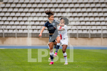 2021-05-06 - Clara Mateo of Paris FC and Ashley Lawrence of Paris Saint Germain fight for the ball during the Women's French championship D1 Arkema football match between Paris FC and Paris Saint-Germain on May 6, 2021 at Charlety stadium in Paris, France - Photo Melanie Laurent / A2M Sport Consulting / DPPI - PARIS FC VS PARIS SAINT-GERMAIN - FRENCH WOMEN DIVISION 1 - SOCCER