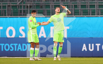 2020-11-08 - Wout Weghorst of Wolfsburg celebrates after the 2-0 goal with Maxence Lacroix during the German championship Bundesliga football match between VfL Wolfsburg and TSG Hoffenheim on November 8, 2020 at Volkswagen Arena in Wolfsburg, Germany - Photo Ralf Ibing / firo Sportphoto / DPPI - VFL WOLFSBURG VS TSG HOFFENHEIM - GERMAN BUNDESLIGA - SOCCER