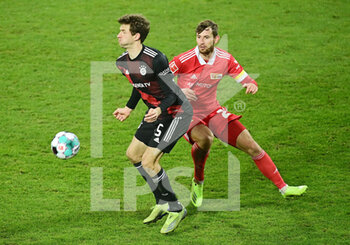 2020-12-12 - Thomas Mueller of Bayern Munich and Christopher Lenz of Union Berlin during the German championship Bundesliga football match between Union Berlin and Bayern Munich on December 12, 2020 at An der Alten Forsterei in Berlin, Germany - Photo Tim Groothuis / Witters / firo Sportphoto / DPPI - UNION BERLIN VS BAYERN MUNICH - GERMAN BUNDESLIGA - SOCCER