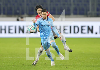 2020-12-15 - Danilo Soares of Bochum and Genki Haraguchi of Hannover 96 during the German championship Bundesliga football match between Hannover 96 and VfL Bochum on December 15, 2020 at HDI-Arena in Hannover, Germany - Photo Ralf Ibing / firo Sportphoto / DPPI - HANNOVER 96 VS VFL BOCHUM - GERMAN BUNDESLIGA - SOCCER