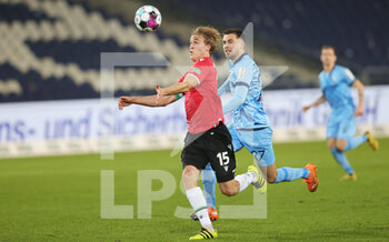 2020-12-15 - Timo Hubers of Hannover 96 and Milos Pantovic of Bochum during the German championship Bundesliga football match between Hannover 96 and VfL Bochum on December 15, 2020 at HDI-Arena in Hannover, Germany - Photo Ralf Ibing / firo Sportphoto / DPPI - HANNOVER 96 VS VFL BOCHUM - GERMAN BUNDESLIGA - SOCCER