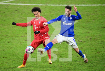 2021-01-24 - Leroy Sane of Bayern Munich and Mark Uth of Schalke 04 during the German championship Bundesliga football match between Schalke 04 and Bayern Munich on January 24, 2021 at Veltins-Arena in Gelsenkirchen, Germany - Photo Tim Groothuis / Witters / firo Sportphoto / DPPI - SCHALKE 04 AND BAYERN MUNICH - GERMAN BUNDESLIGA - SOCCER
