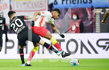 2021-01-30 - Christopher Nkunku of RB Leipzig and Charles Aranguiz of Bayer 04 Leverkusen during the German championship Bundesliga football match between RB Leipzig and Bayer 04 Leverkusen on January 30, 2021 at Red Bull Arena in Leipzig, Germany - Photo Tim Groothuis / Witters / firo Sportphoto / DPPI - RB LEIPZIG AND BAYER 04 LEVERKUSEN - GERMAN BUNDESLIGA - SOCCER