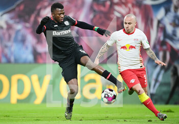 2021-01-30 - Edmond Tapsoba of Bayer 04 Leverkusen and Angelino of RB Leipzig during the German championship Bundesliga football match between RB Leipzig and Bayer 04 Leverkusen on January 30, 2021 at Red Bull Arena in Leipzig, Germany - Photo Tim Groothuis / Witters / firo Sportphoto / DPPI - RB LEIPZIG AND BAYER 04 LEVERKUSEN - GERMAN BUNDESLIGA - SOCCER