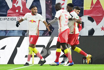 2021-01-30 - Christopher Nkunku of RB Leipzig celebrates after his goal with Dayot Upamecano, Nordi Mukiele during the German championship Bundesliga football match between RB Leipzig and Bayer 04 Leverkusen on January 30, 2021 at Red Bull Arena in Leipzig, Germany - Photo Tim Groothuis / Witters / firo Sportphoto / DPPI - RB LEIPZIG AND BAYER 04 LEVERKUSEN - GERMAN BUNDESLIGA - SOCCER