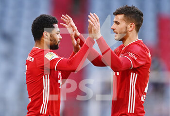 2021-02-27 - Serge Gnabry of Bayern Munich celebrates the 5-1 goal with Lucas Hernandez during the German championship Bundesliga football match between Bayern Munich and FC Koln on February 27, 2021 at Allianz Arena in Munich, Germany - Photo Lennart Preiss / Witters / firo Sportphoto / DPPI - BAYERN MUNICH AND FC KOLN - GERMAN BUNDESLIGA - SOCCER