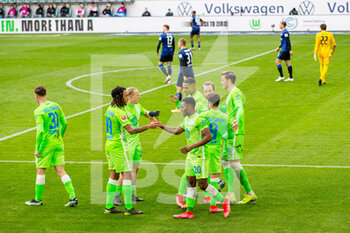 2021-02-27 - Wolfsburg players celebrate after the Lukas Kluenter's own goal during the German championship Bundesliga football match between VfL Wolfsburg and Hertha BSC Berlin on February 27, 2021 at Volkswagen Arena in Wolfsburg, Germany - Photo Max Ellerbrake / firo Sportphoto / DPPI - VFL WOLFSBURG AND HERTHA BSC BERLIN - GERMAN BUNDESLIGA - SOCCER