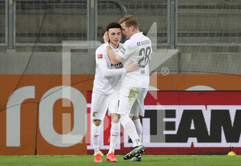 2021-03-12 - Ruben Vargas of Augsburg celebrates after his goal with Andre Hahn during the German championship Bundesliga football match between FC Augsburg and VfL Borussia Moenchengladbach on March 12, 2021 at WWK Arena in Augsburg, Germany - Photo Marcel Engelbrecht / firo Sportphoto / DPPI - FC AUGSBURG AND VFL BORUSSIA MOENCHENGLADBACH - GERMAN BUNDESLIGA - SOCCER