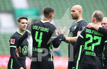 2021-03-17 - Maxence Lacroix of Wolfsburg celebrates with John Anthony Brooks after the 0-1 goal during the German championship Bundesliga football match between SV Werder Bremen and VfL Wolfsburg on March 20, 2021 at the Weserstadion in Bremen, Germany - Photo Sebastian El-Saqqa / firo sportphoto / DPPI - SV WERDER BREMEN AND VFL WOLFSBURG - GERMAN BUNDESLIGA - SOCCER