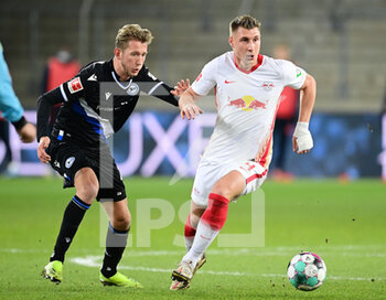 2021-03-19 - Willi Orban of RB Leipzig and Michel Vlap of Arminia Bielefeld during the German championship Bundesliga football match between Arminia Bielefeld and RB Leipzig on March 19, 2021 at the Schueco Arena in Bielefeld, Germany - Photo Tim Groothuis / Witters / firo sportphoto / DPPI - ARMINIA BIELEFELD AND RB LEIPZIG - GERMAN BUNDESLIGA - SOCCER