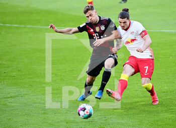 2021-04-03 - Joshua Kimmich of Bayern Munich and Marcel Sabitzer of RB Leipzig during the German championship Bundesliga football match between RB Leipzig and Bayern Munich on April 3, 2021 at Red Bull Arena in Leipzig, Germany - Photo Valeria Witters / Witters / firo sportphoto / DPPI - RB LEIPZIG VS BAYERN MUNICH - GERMAN BUNDESLIGA - SOCCER