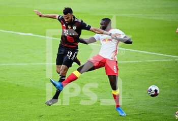 2021-04-03 - Eric Maxim Choupo-Moting of Bayern Munich and Dayot Upamecano of RB Leipzig during the German championship Bundesliga football match between RB Leipzig and Bayern Munich on April 3, 2021 at Red Bull Arena in Leipzig, Germany - Photo Valeria Witters / Witters / firo sportphoto / DPPI - RB LEIPZIG VS BAYERN MUNICH - GERMAN BUNDESLIGA - SOCCER