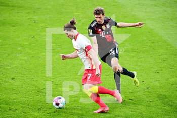 2021-04-03 - Marcel Sabitzer of RB Leipzig and Thomas Mueller of Bayern Munich during the German championship Bundesliga football match between RB Leipzig and Bayern Munich on April 3, 2021 at Red Bull Arena in Leipzig, Germany - Photo Valeria Witters / Witters / firo sportphoto / DPPI - RB LEIPZIG VS BAYERN MUNICH - GERMAN BUNDESLIGA - SOCCER