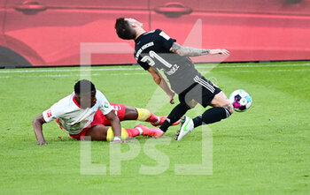 2021-04-03 - Nordi Mukiele of RB Leipzig tackles Lucas Hernandez of Bayern Munich during the German championship Bundesliga football match between RB Leipzig and Bayern Munich on April 3, 2021 at Red Bull Arena in Leipzig, Germany - Photo Valeria Witters / Witters / firo sportphoto / DPPI - RB LEIPZIG VS BAYERN MUNICH - GERMAN BUNDESLIGA - SOCCER