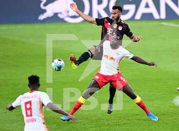 2021-04-03 - Eric Maxim Choupo-Moting of Bayern Munich and Dayot Upamecano of RB Leipzig during the German championship Bundesliga football match between RB Leipzig and Bayern Munich on April 3, 2021 at Red Bull Arena in Leipzig, Germany - Photo Valeria Witters / Witters / firo sportphoto / DPPI - RB LEIPZIG VS BAYERN MUNICH - GERMAN BUNDESLIGA - SOCCER
