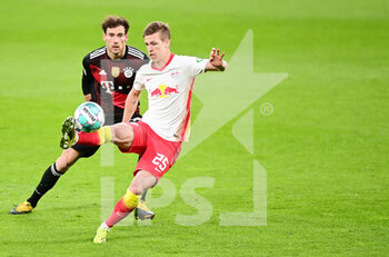 2021-04-03 - Dani Olmo of RB Leipzig and Leon Goretzka of Bayern Munich during the German championship Bundesliga football match between RB Leipzig and Bayern Munich on April 3, 2021 at Red Bull Arena in Leipzig, Germany - Photo Valeria Witters / Witters / firo sportphoto / DPPI - RB LEIPZIG VS BAYERN MUNICH - GERMAN BUNDESLIGA - SOCCER