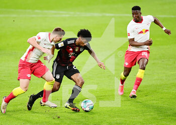 2021-04-03 - Kingsley Coman of Bayern Munich and Willi Orban, Nordi Mukiele of RB Leipzig during the German championship Bundesliga football match between RB Leipzig and Bayern Munich on April 3, 2021 at Red Bull Arena in Leipzig, Germany - Photo Valeria Witters / Witters / firo sportphoto / DPPI - RB LEIPZIG VS BAYERN MUNICH - GERMAN BUNDESLIGA - SOCCER