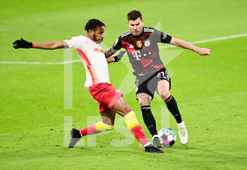 2021-04-03 - Christopher Nkunku of RB Leipzig and Lucas Hernandez of Bayern Munich during the German championship Bundesliga football match between RB Leipzig and Bayern Munich on April 3, 2021 at Red Bull Arena in Leipzig, Germany - Photo Valeria Witters / Witters / firo sportphoto / DPPI - RB LEIPZIG VS BAYERN MUNICH - GERMAN BUNDESLIGA - SOCCER